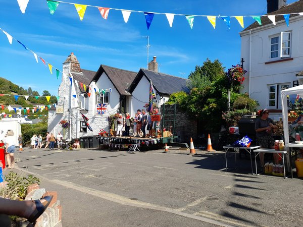 Which local festivals in Devon celebrate traditional music?